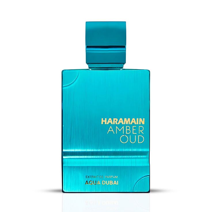 Frasco azul turquesa de Al Haramain Amber Oud Aqua Dubai 100ml Extrait de Parfum junto a su caja